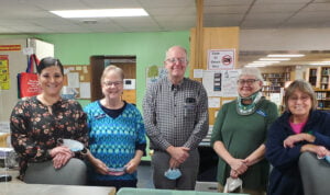 RRDL Staff photo behind the staff counter.